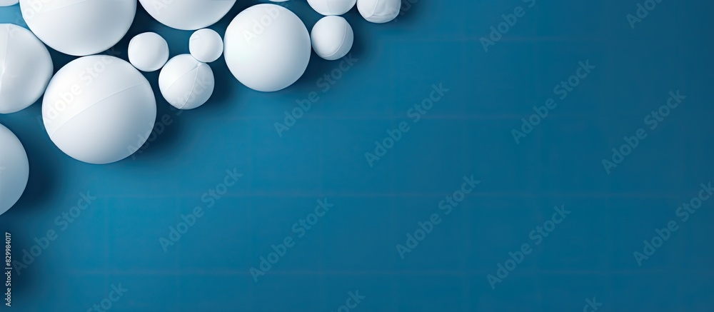 Poster a blue background featuring wadded paper balls and copy space image