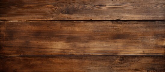 Fototapeta premium An aged brown wooden surface with a grunge texture serves as the background for this copy space image