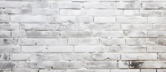 Fototapeta premium A white brick wall serves as a suitable texture or background for an image with empty spaces for additional content