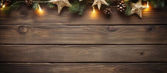 Festive Christmas decorations arranged on a rustic wooden background creating a beautiful copy...