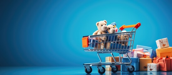 Blue background with toy shopping cart stacked with boxes Copy space image for text or design Represents sale discount shopping and delivery concept in consumer society trend