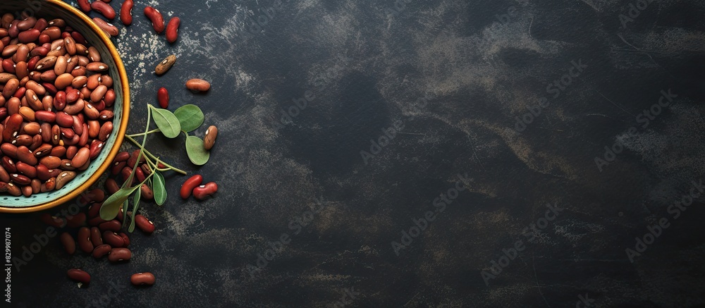 Aufkleber Copy space image featuring a dark concrete background with a bowl filled with beans encompassing the concept of organic food