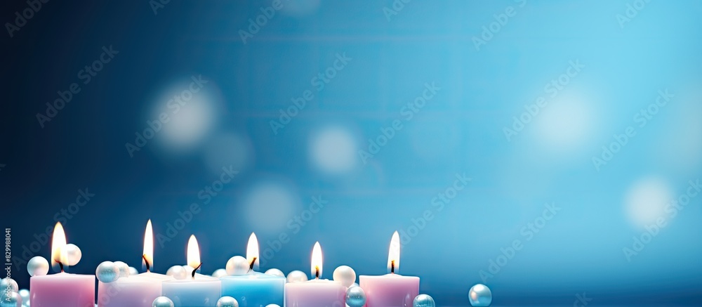 Poster blue background with copy space image of a birthday greeting card adorned with marshmallows and bead