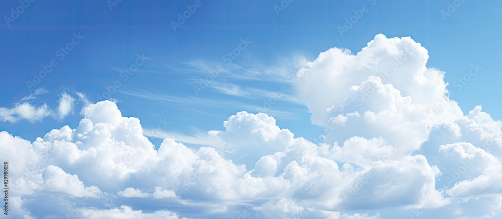 Poster the expansive blue sky with fluffy clouds as a copy space image