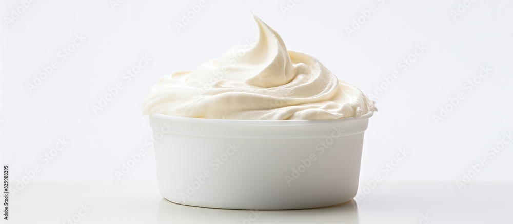 Poster a dollop of homemade cream cheese sits on a white backdrop emphasizing the idea of a copy space imag