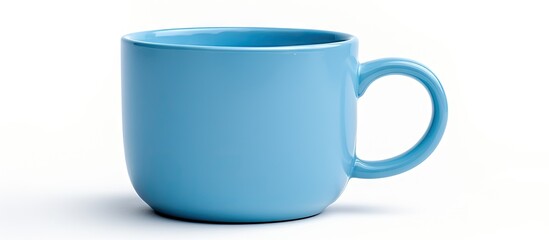 A coffee cup with a perfect blue color is seen in a close up shot on a white background providing ample space for a potential image