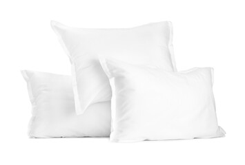 Many new soft pillows isolated on white