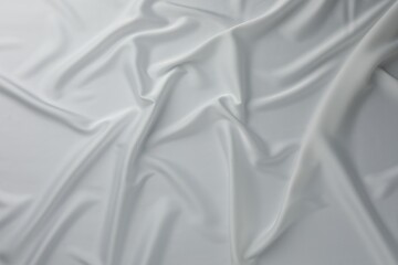 Texture of crumpled white silk fabric as background, top view