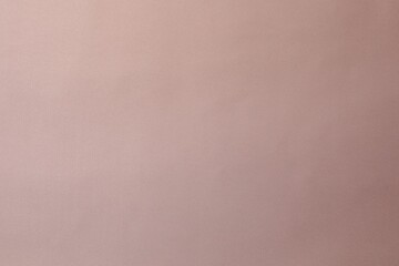 Pink silk fabric as background, top view