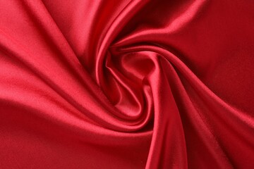 Texture of beautiful red silk fabric as background, closeup