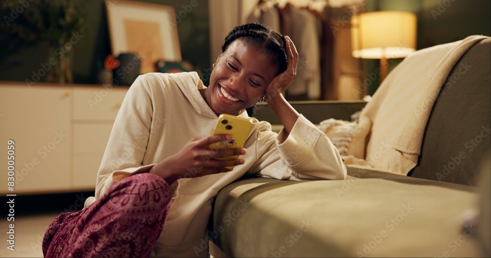 Canvas Prints Happy, laugh and black woman with phone on sofa for online chat, communication and networking. Relax, home and person on smartphone for social media, funny website and internet news in living room