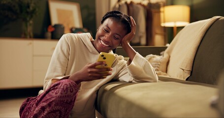 Happy, laugh and black woman with phone on sofa for online chat, communication and networking....
