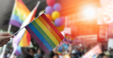 LGBTQ+ pride parade rainbow flag as a symbol of lesbian, gay, bisexual, transgender, and queer pride and LGBTQ social movements in June month.