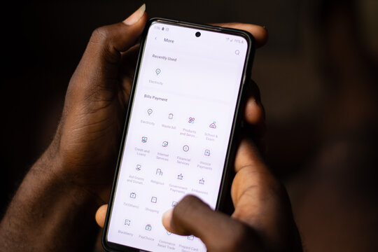 Lugbe, Abuja-Nigeria - April 22nd 2024: african person using opay mobile app