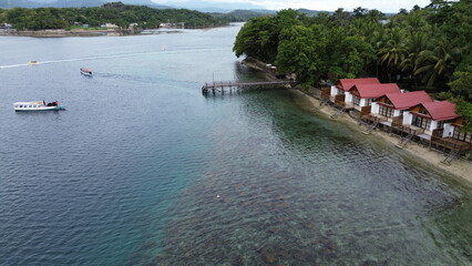 Aerial view of the harbor atmosphere on Dutungan Island with dense trees