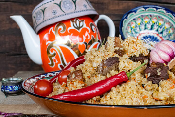 national Central Asian dish pilaf is cooked over an open fire with vegetables and fruits.