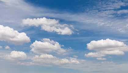 white fluffy clouds in the blue sky