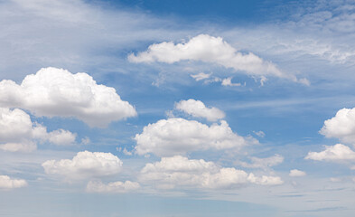 white fluffy clouds in the blue sky