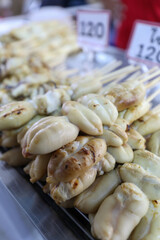 Grilled Big White Squid and Squid Tentacles, Street food in Thailand.