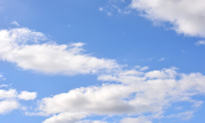 a blue sky with some white clouds web banner