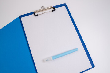 Blank tablet with a white sheet and a pen on a light background. A4 holder. Stationery. Blank document holder with space for text. Mockup