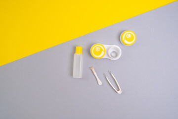 Container for lenses and accessories on a light background. Health and medicine concept