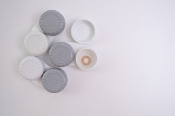 Container for lenses and accessories on a light background. Health and medicine concept
