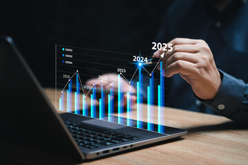 Business Goals Trends to 2025 concept, Businessman use laptops for analytical business planning of...