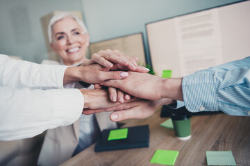 Photo of business people doing team building support seminar in workstation workplace