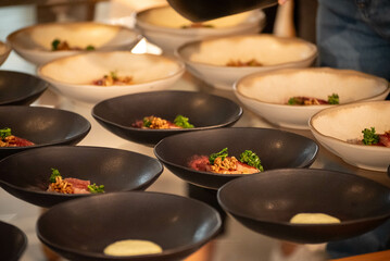 fine food beeing batch prepared on plate