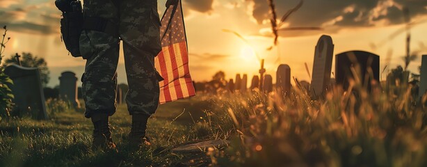 Close up of a soldier holding an American flag in his hand, standing at a graveyard with tombstones in the background, in the style of cinematic, sunset light, shallow depth of field, warm tones, phot
