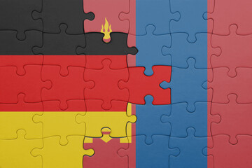 puzzle with the colourful national flag of mongolia and flag of germany.
