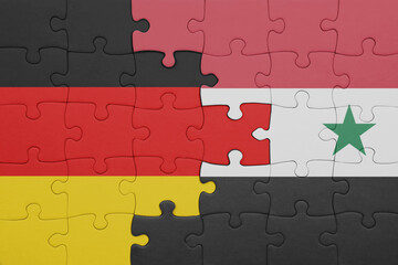puzzle with the colourful national flag of syria and flag of germany.