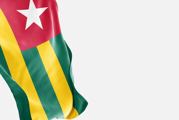 National flag of Togo flutters in the wind. Wavy Togo Flag. Close-up front view.