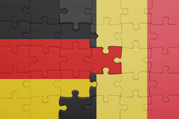 puzzle with the colourful national flag of belgium and flag of germany.