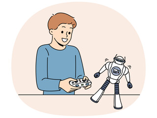 Boy with toy remote controlled robot for concept of learning robotics. Schoolboy is passionate about playing with robot and dreams of becoming engineer or creating cyborgs with artificial intelligence