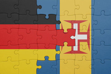 puzzle with the colourful national flag of madeira and flag of germany.