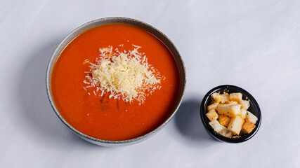 Tomato soup bowl top view isolated