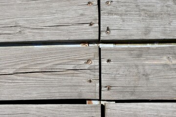 A close view of the old wood boards of the deck.