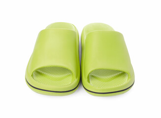 Pair of green rubber slippers isolated on white