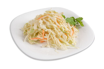A plate of creamy coleslaw in a restaurant