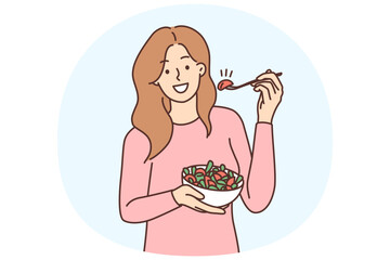Smiling woman eating salad