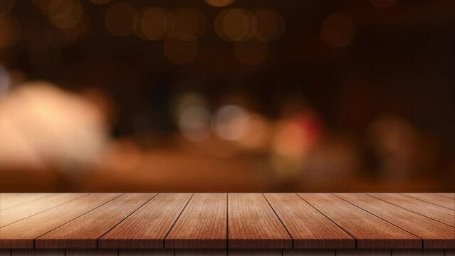 Empty wooden table top with lights bokeh on blur restaurant background.