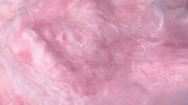 Light pink sweet fluffy cotton candy texture circle rotation close up