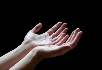 The outstretched hands of a praying man
