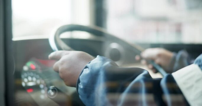 Hands, bus and driving public transportation as city service for passengers downtown, metro or journey. Person, steering wheel and vehicle for morning commute in Boston for traveling, traffic or job