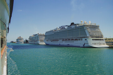 Big modern cruiseship or cruise ship liner Bliss in Port of Miami, Florida with downtown skyline...