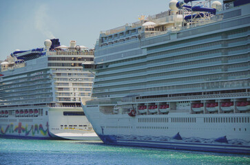 Big modern cruiseship or cruise ship liner Bliss in Port of Miami, Florida with downtown skyline...