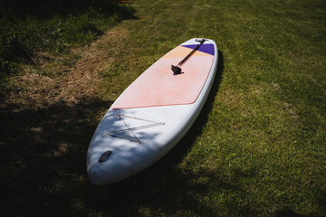 Indulge in a summer adventure with standup paddleboarding outdoors. Immerse yourself in nature,...
