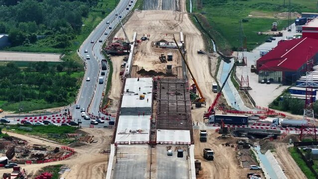 Romania A1 highway construction site. Aerial 4k video of A1 road that connects Bucharest Pitesti highway with Curtea de Arges and Sibiu. Infrastructure construction industry in Romania.